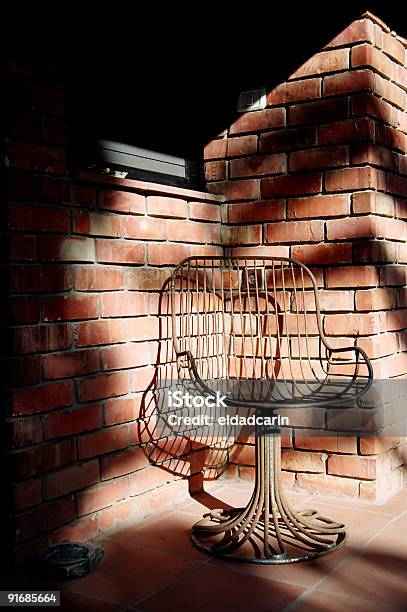 Metal Chair In Afternoon Sun Stock Photo - Download Image Now - American Culture, Ashtray, Brick