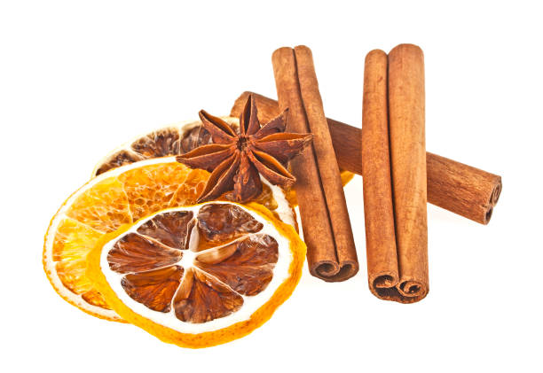 istock Anise, cinnamon sticks and dried orange and lemon slices on a white background 916858518