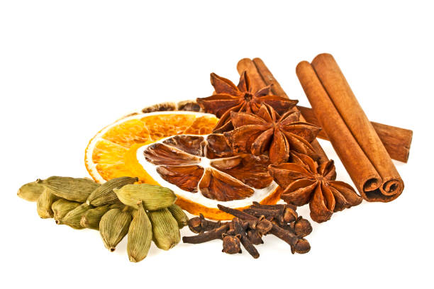 istock Anise, cardamom, carnation, dried orange and cinnamon sticks on a white background. Spices. 916858542