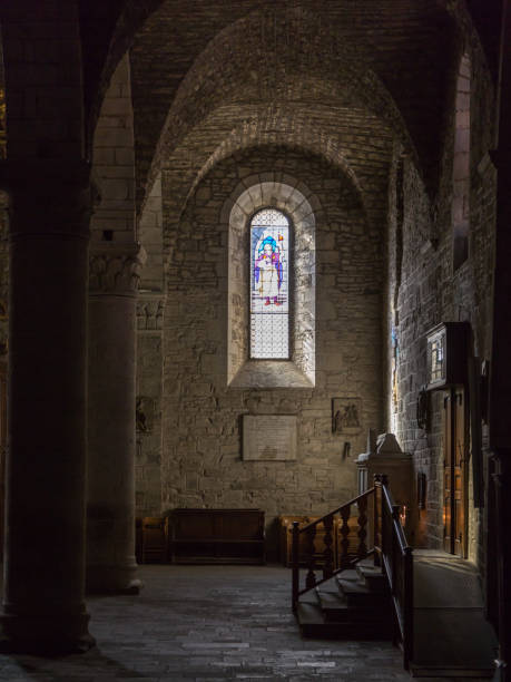 istock Rays of Light Through Stained Glass, Old Ancient Window in a Church 916858652