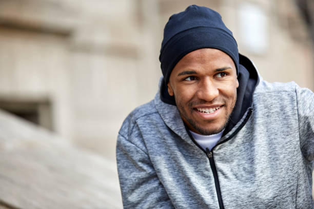 istock Sporty mid adult man smiling while looking away 916859452