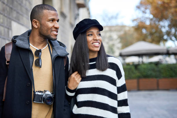 istock Thoughtful couple looking away in city 916859964