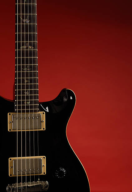 istock Electric Guitar on a red background 91686077