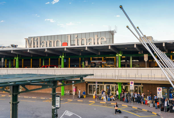 entrance to milan linate, which services short and medium-range destinations in europe and is alitalia's hub - travel passenger milan italy italy imagens e fotografias de stock