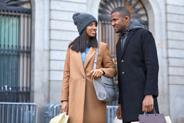 istock Young couple talking against building in city 916862368