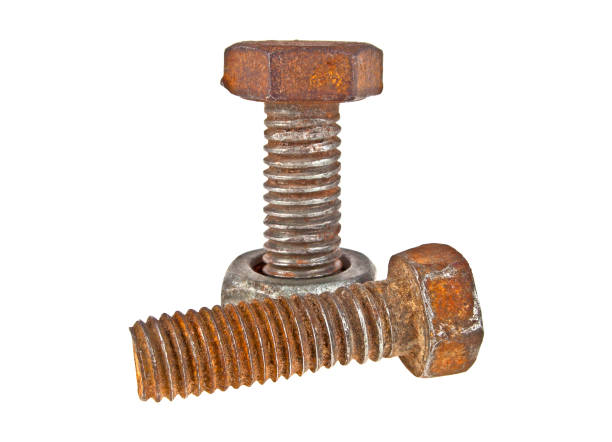 istock Two old rusty bolts and screw-nut isolated on white background 916862898