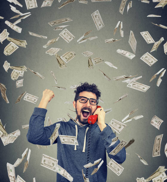 istock Excited man winning having phone call 916863594