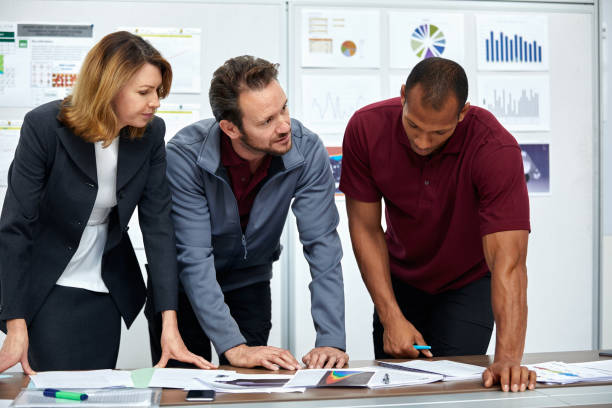 Engineers and manager having meeting in office