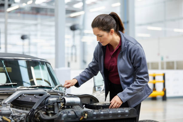 istock Female engineer repairing car in industry 916867960