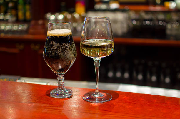 istock Glasses with beer and white wine 916873496