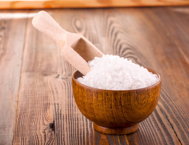 istock white bath salt in a wooden Cup on wooden surface 916873734
