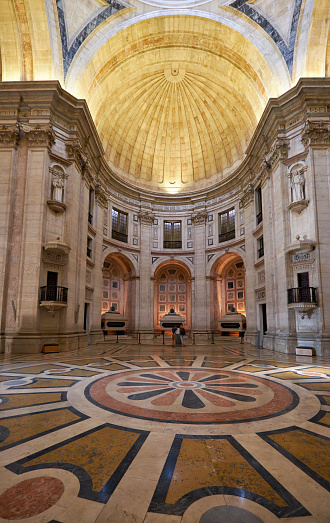 LISBON, PORTUGAL - JUNE 25, 2016: Interior of National Pantheon (Santa Engracia church). View of floor decorated with polychromed patterns of marble and apse with three cenotaphs. Lisbon. Portugal