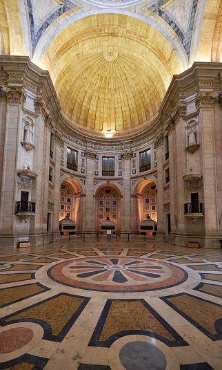 LISBON, PORTUGAL - JUNE 25, 2016: Interior of National Pantheon (Santa Engracia church). View of floor decorated with polychromed patterns of marble and apse with three cenotaphs. Lisbon. Portugal