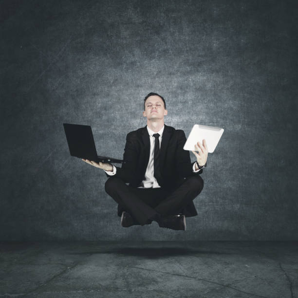 istock caucasian businessman floating in air 916874222