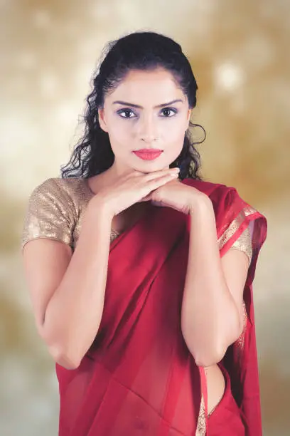 Beautiful Indian woman posing over blurred background