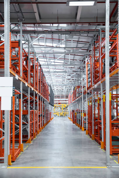 istock Walkway amidst shelves at automobile industry 916875188