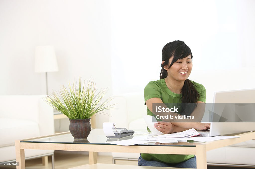 Woman working on finances  Adding Machine Tape Stock Photo