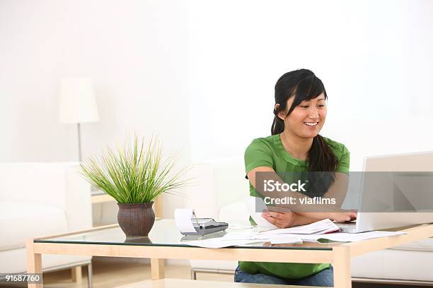 Woman Working On Finances Stock Photo - Download Image Now - Adding Machine Tape, File Folder, Tax Form