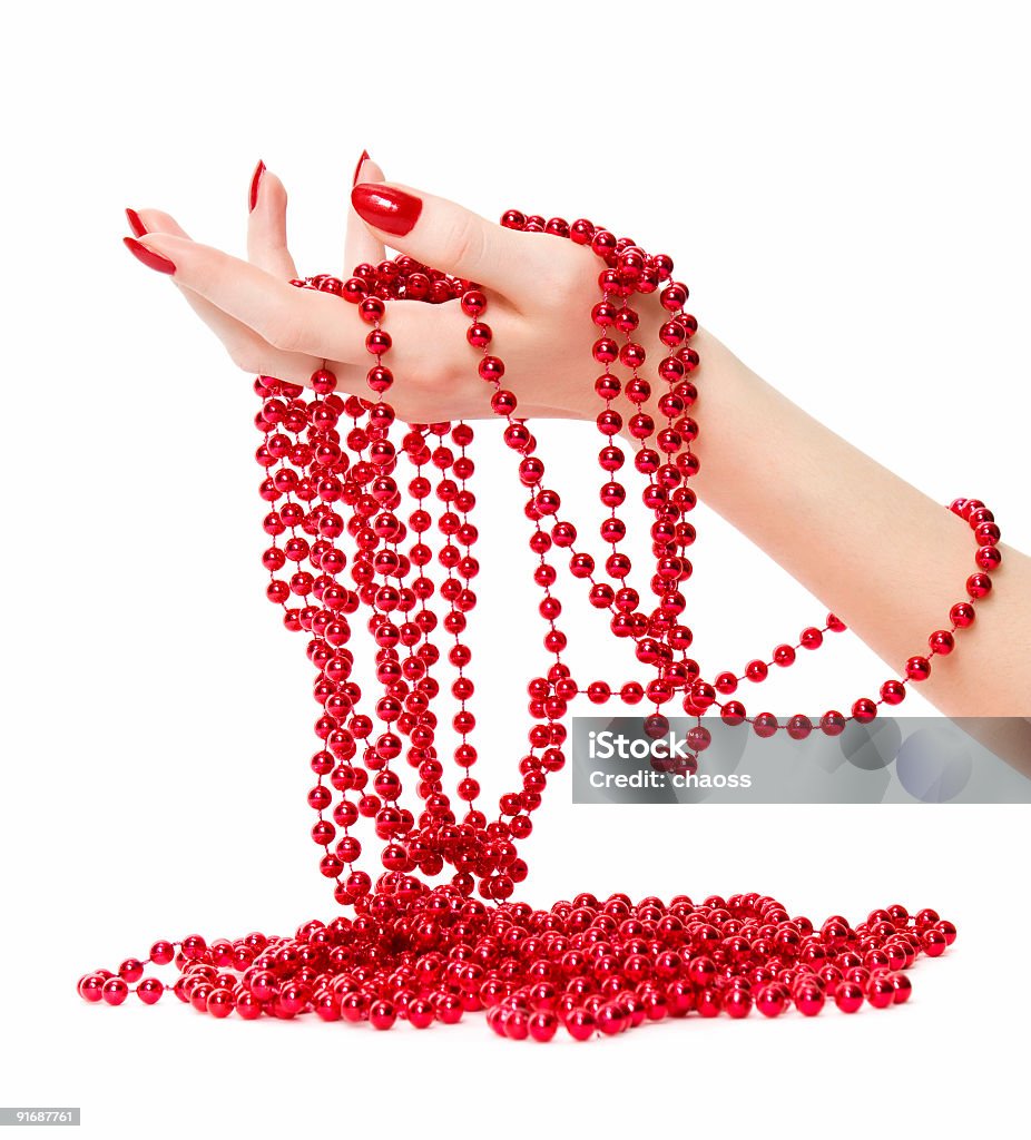 Donna mano holding rosso glassbeads - Foto stock royalty-free di Adulto
