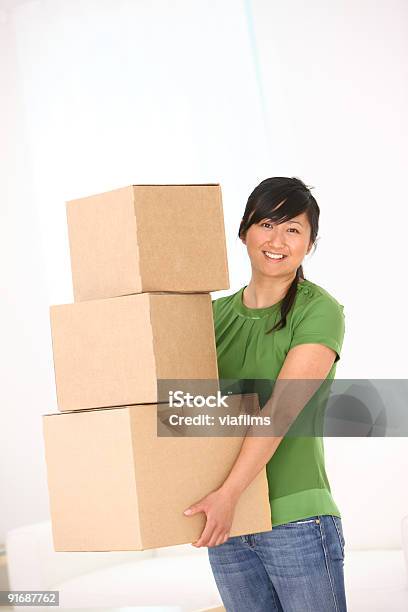 Young Woman Holding A Stack Of Boxes Stock Photo - Download Image Now - 20-24 Years, 25-29 Years, Adult