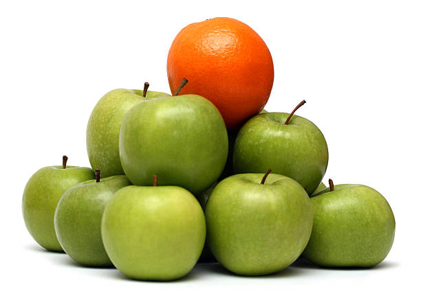 istock domination concepts - orange on pyramyd of apples 91688118