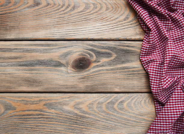 istock Checkered napkin on a wooden background 916881452