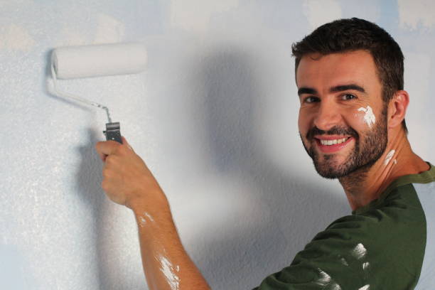 istock Handsome male about to paint a wall 916881928