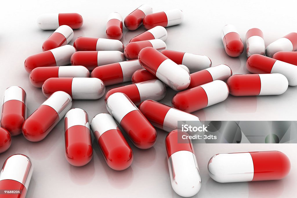 Pillole mediche (isolato su bianco - Foto stock royalty-free di Accudire