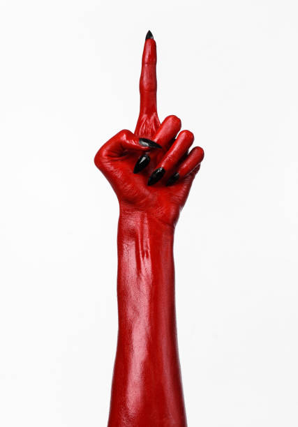 istock Red Devil's hands, red hands of Satan, Halloween theme, white background, isolated 916882168