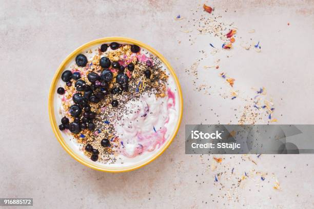 Coconut Blueberry Breakfast Bowl With Chia And Sesame Seeds Stock Photo - Download Image Now