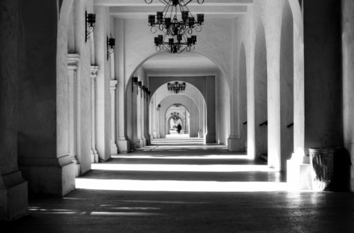Black and white image of the hallway at The Prado, Balboa Park, San Diego, CA.