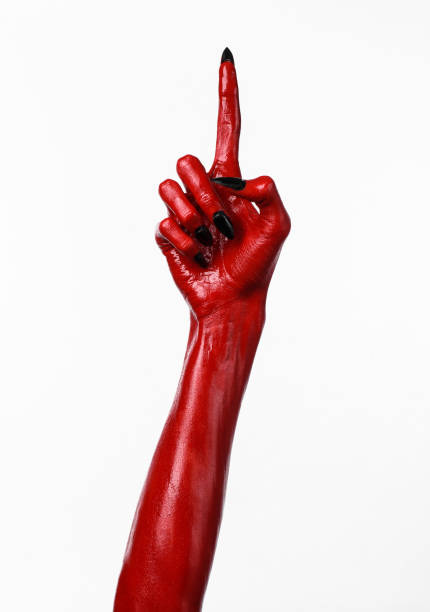 istock Red Devil's hands, red hands of Satan, Halloween theme, white background, isolated 916888830