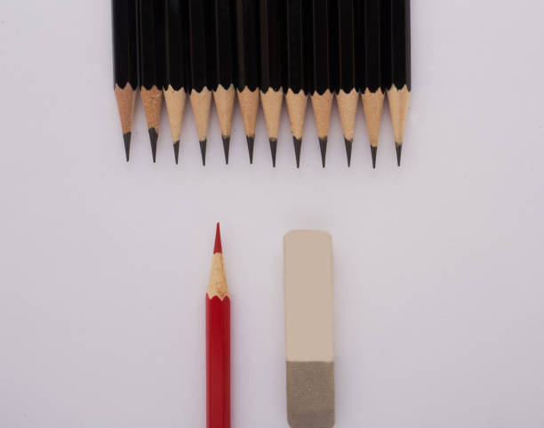 istock Eraser, Red and black pencils isolated on white background 916890200