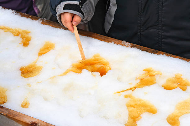 istock Child putting on a sick maple taffy 91689100