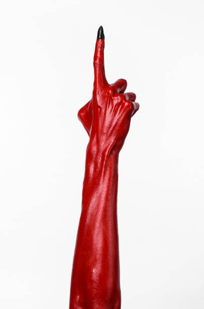 istock Red Devil's hands, red hands of Satan, Halloween theme, white background, isolated 916895206