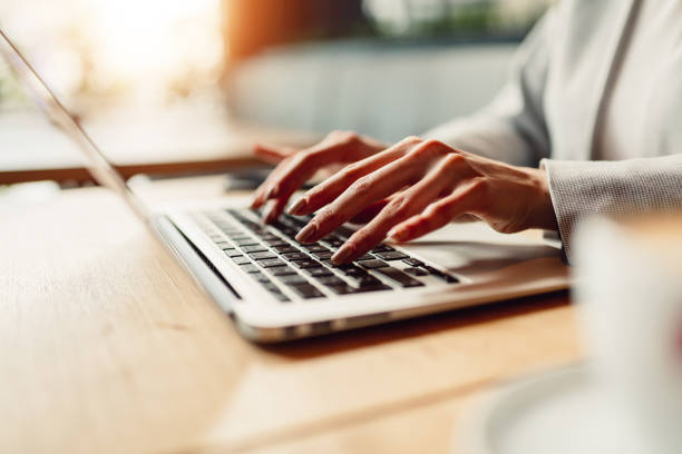 istock Close-up of girl hands while typing on keyboard. 916895362