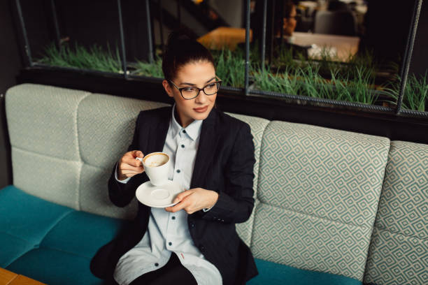 istock Businesswoman enjoying coffee. 916895548
