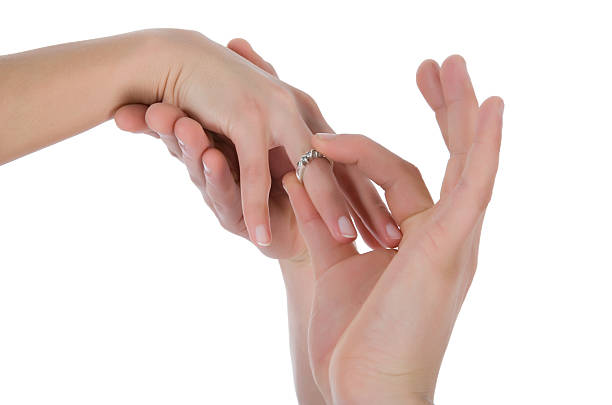 istock Man's and female hands with a wedding ring 91689611