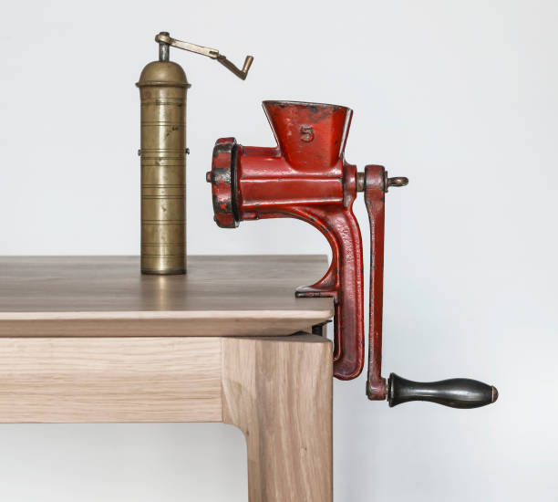 istock Vintage red grinding machine and brass coffee grinder 916899624
