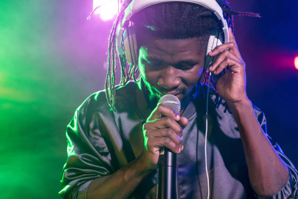 istock DJ in headphones with microphone on concert 916904202