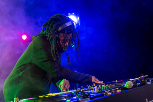 istock DJ in headphones with sound mixer 916907028
