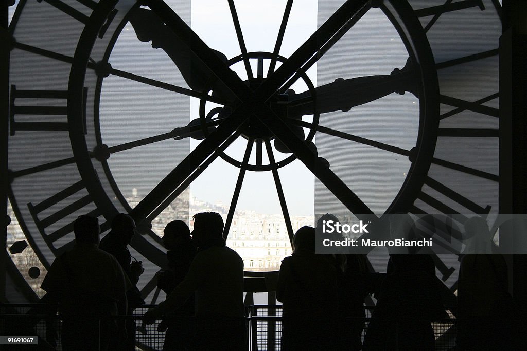 People walking near a big clock  Aspirations Stock Photo
