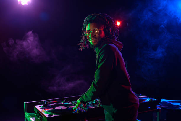 istock DJ with sound mixer in nightclub 916910856