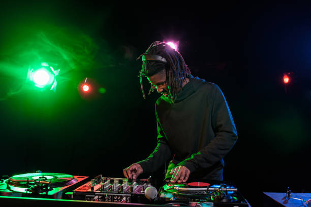 istock DJ with sound mixer in nightclub 916910902