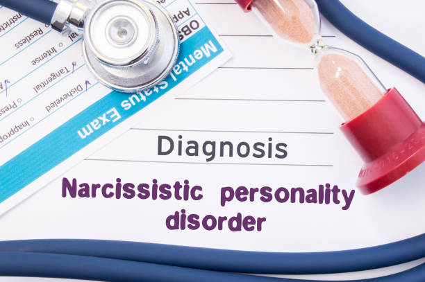 Diagnosis Narcissistic Personality Disorder (NPD). On psychiatrist or psychologist table is paper with inscription Narcissistic personality disorder near psychiatric report, hourglass and stethoscope Diagnosis Narcissistic Personality Disorder (NPD). On psychiatrist or psychologist table is paper with inscription Narcissistic personality disorder near psychiatric report, hourglass and stethoscope national democratic party of germany stock pictures, royalty-free photos & images