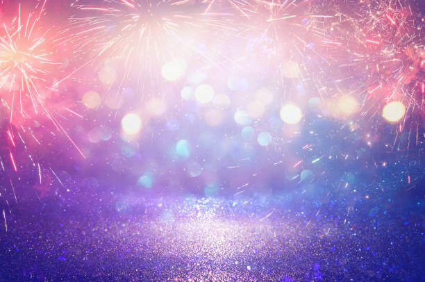 istock Purple and blue glitter lights background. defocused. 916914322
