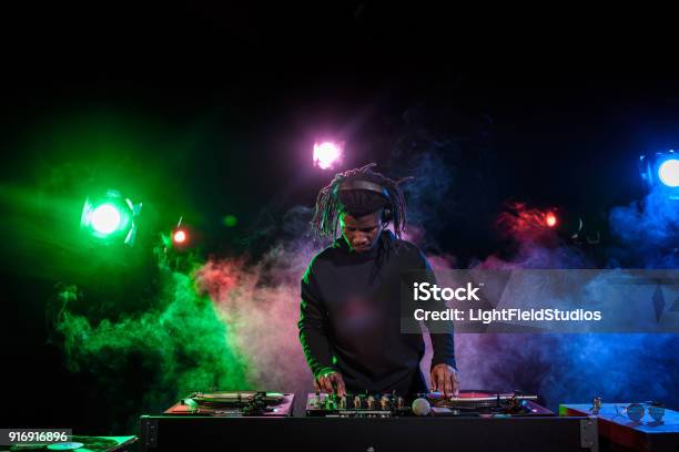 Dj In Headphones With Sound Mixer Stock Photo - Download Image Now - DJ, Party - Social Event, Adult