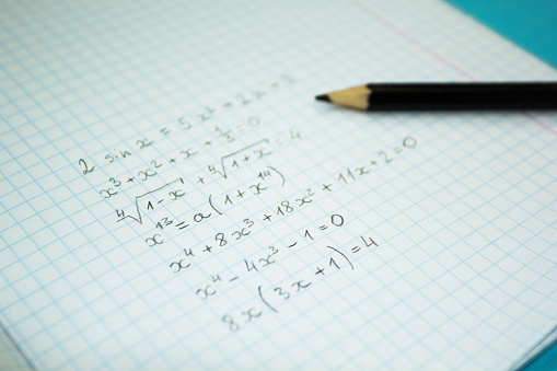 Mathematical examples and calculations in a notebook for lectures.
