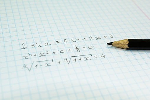 Mathematical formulas in a notebook for lectures.