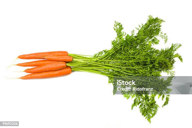 Bunch Of Carrots With Stems On White Background Stock Photo - Download Image Now - Carrot, Bunch, Cut Out